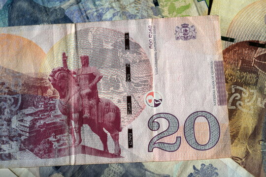 Reverse side of 20 Georgian lari banknote featuring King Vakhtang Gorgasali monument, Narikala fortress and national emblem