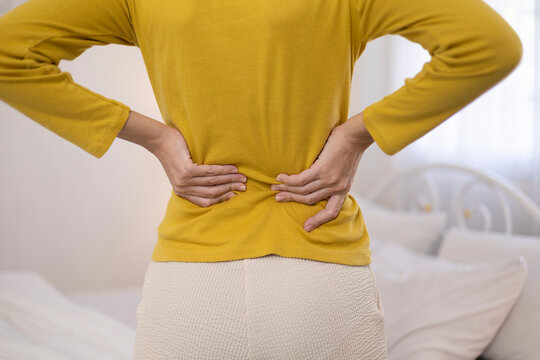 The young woman felt aches and pains throughout her body while standing. She experienced pain and stiffness in her back, as well as muscle spasms and general discomfort.
