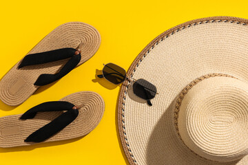 Plakat Summer accessories on yellow background with flip flops and sun hat