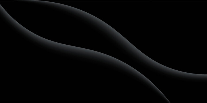 Sandblasted or brushed titanium or steel metal surface, the light reflection of the curved lines creates a smooth gradation on the dark black metallic background