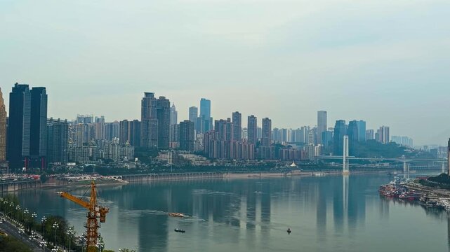 City Skyline From Long Men Hao Viewpoint Across The Yangtze River In Nan'an District, Chongqing, China. Pan Wide Shot