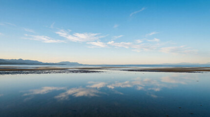 Fototapeta premium Clear Sky Reflection in Huge Shallow Tidal Bay No Human Serene Atmospheric Wide Landscape Photography
