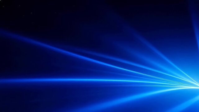 Blue light beams on dark background