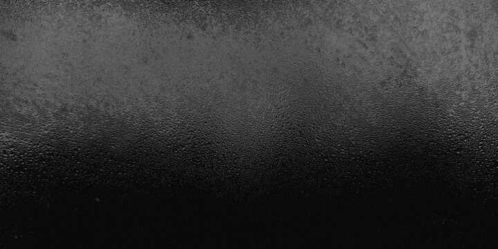 Dark black frosted glass texture with grainy noise and tiny condensed water rain drops. Abstract textured background with  subtle top light gradient effect