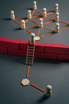 Person climbing barrier to join connected network and access new opportunities