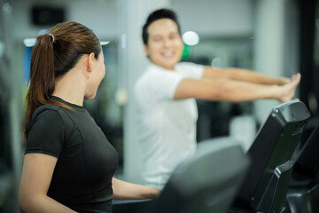 Fototapeta premium The modern gym interior features dumbbells, barbells, treadmills, and strength-training equipment, promoting exercise, muscle building, a healthy lifestyle, training, and physical fitness.