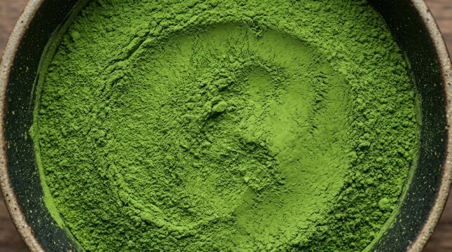 Top view of vibrant green matcha tea powder texture
