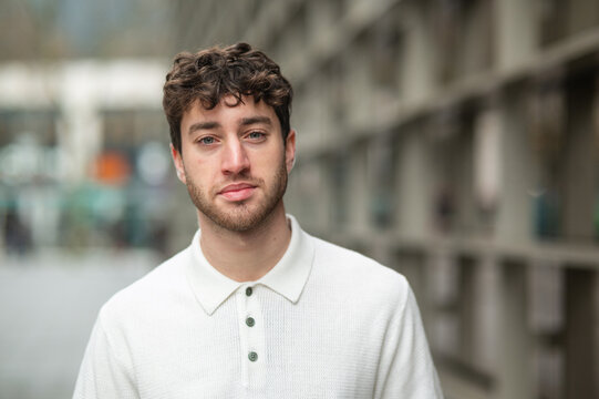Young man posing confident casual in urban street