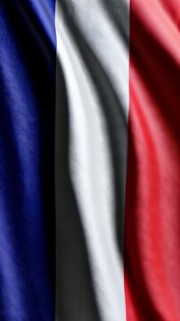 France flag waving gracefully in the wind, vertical video featuring vibrant tricolor colors, realistic fabric motion and patriotic national pride