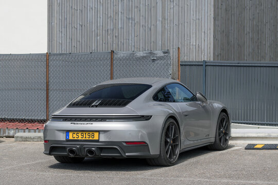 Nancy, France - May 30th 2026 : View on a grey Porsche 992 Carrera GTS parked on a parking lot.