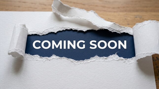 Torn paper revealing COMING SOON message, announcement concept, ripped edge, teaser note