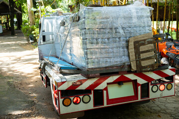 Naklejka premium Pallet plastic wrap delivery transportation truck outdoor logistics cargo shipping industrial heavy equipment vehicle supply freight package distribution warehouse road machinery