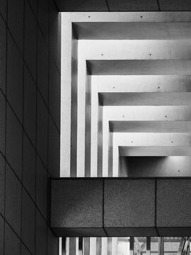 Concrete wall columns Geometric pattern shade shadow Gradation Grey texture Brutalist Building Architecture details	