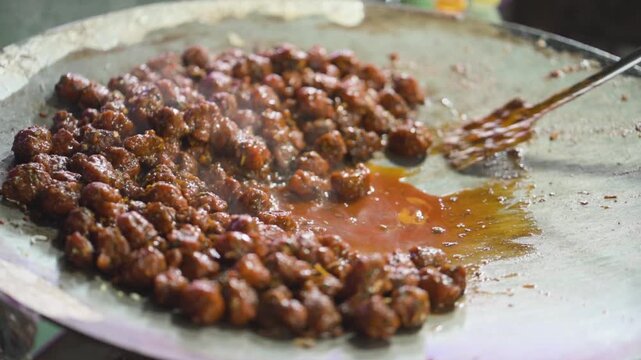 Manchurian Cooking on Hot Griddle, Street Style Veg Manchurian Preparation, Indo Chinese Manchurian on Tawa, Spicy Manchurian Street Food stock video.