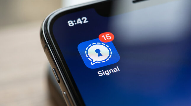 Close-up of the Signal messenger app icon displayed on a smartphone screen with a red notification badge, illustrating secure communication, data privacy, and mobile encryption technology. iPhone.