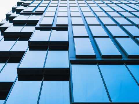 Architecture details blue Glass cubic facade Modern building exterior Geometric background