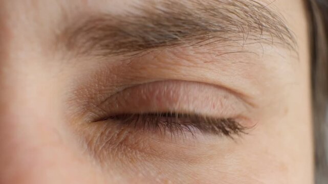 Close-up of a human eye with heavily dilated pupil