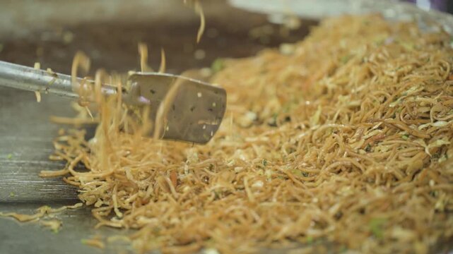 Street Style Chowmein Cooking, Indian Street Food Noodles, Fresh Veg Chowmein Preparation, Hot Noodles on Large Tawa stock video.