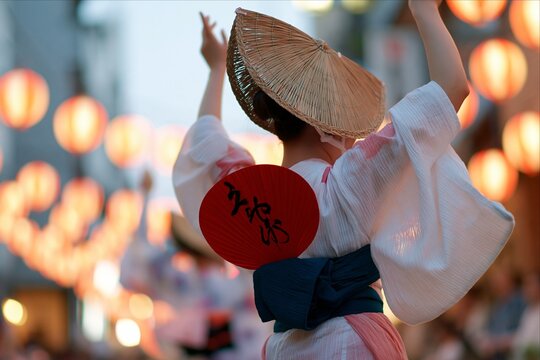 Japanese Obon festival dancer with red fan and lanterns