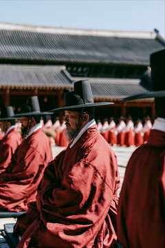 Elderly Korean man in traditional robes at a ceremony