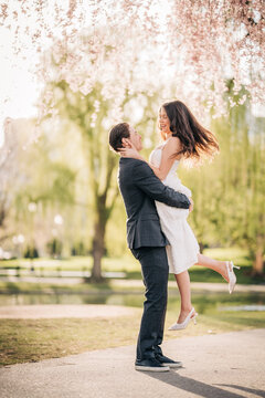 Happy couple celebrating love in spring park