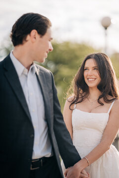 Loving couple holding hands enjoying outdoor romantic moment