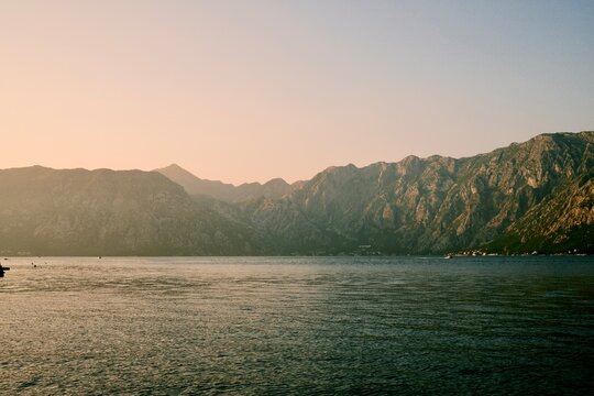 Minimalist Landscape of Layered Mountains in Warm Golden Light