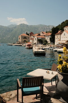Romantic Restaurant Table on the Waterfront of a Coastal Town