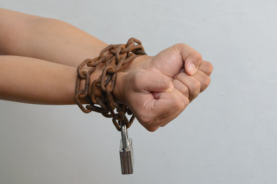 Hands chained tightly