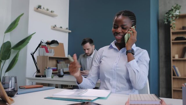 African american businesswoman successfully closing a deal on the phone