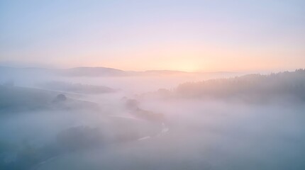 Fototapeta premium Ethereal Sunrise Over Misty Mountain Valleys in Soft Pastel Hues