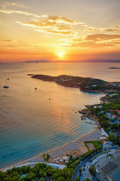 Aerial view of the popular Astir Beach at Vouliagmeni, south Athens coast, Greece, during a beautiful summer sunset