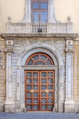 Obraz premium Monumental Wooden Door Of Basilica de la Merce In Barcelona, Baroque Stone Portal, Wrought Iron Panels, Historic Church Entrance
