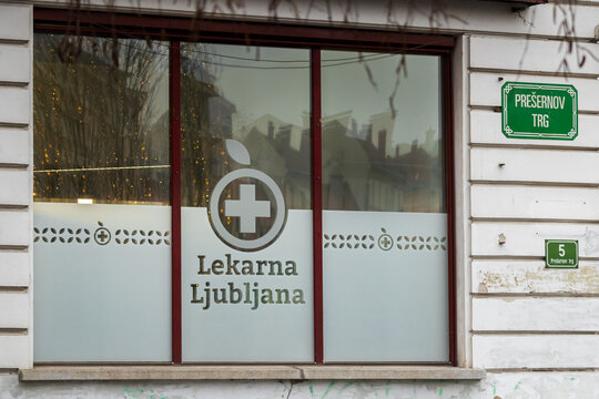 Ljubljana, Slovenia December 27, 2025, Pharmacy Window with Sign Lekarna Ljubljana and Street Name Plate Presernov Trg