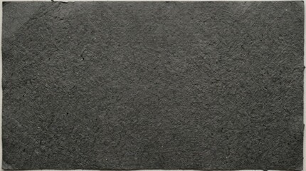 Fototapeta premium High Detail Monochrome Texture of Dark Rough Sandpaper Showing Granular Surface Patterns