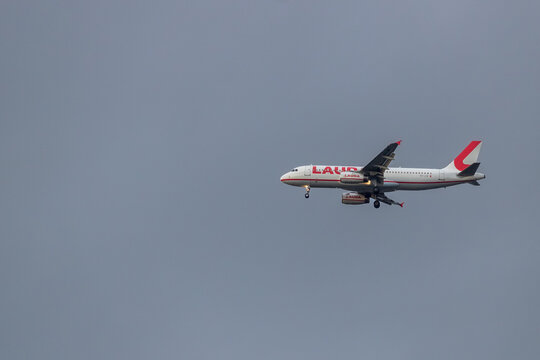  Bologna, Italy July 26, 2025 Lauda Airline Plane  passenger airplane flies in open sky during daytime for air travel and transportation between destinations