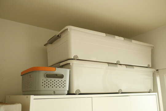 Homeowner organizes belongings for move or seasonal change