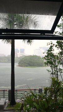 Rainfall on Window with Scenic View of Lake