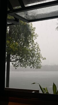 Rainfall Through Window with Scenic View