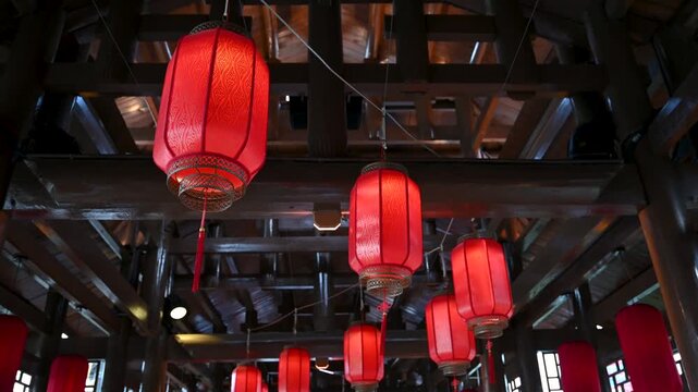 Chinese Red Lanterns Swaying in Traditional Setting