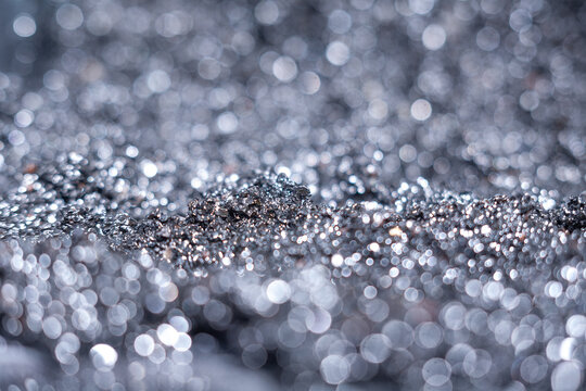 Close-up view of shiny metallic texture with blurred background