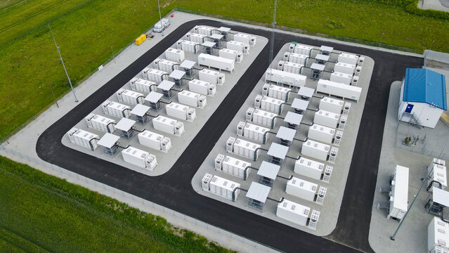 Battery energy storage commercial facility, storing energy in modular containers for sustainable renewable electricity grid stabilization and power management