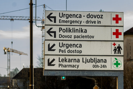 Ljubljana, Slovenia February 26, 2026 directional sign outside a medical facility showing routes to emergency services, polyclinic access