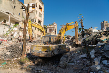 Fototapeta premium Excavator Clearing Urban Demolition Site in Thanh Xuan Hanoi