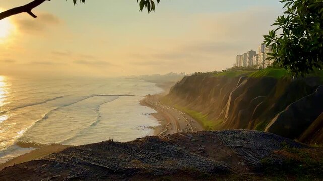 Beautiful sunset reflecting on the pacific ocean from the green cliffs of Miraflores, Lima