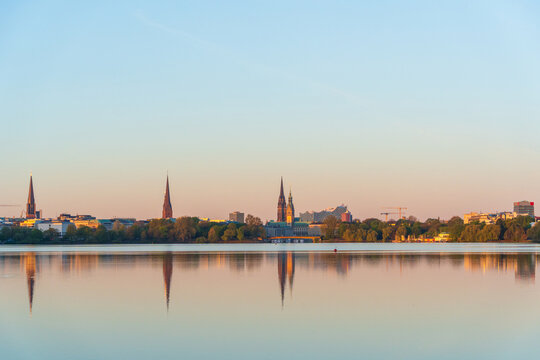 Hamburg skyline reflection on the Alster lake at sunset
