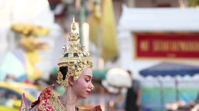 Traditional Thai Dancer in Ornate Gold Costume and Chada Headdress