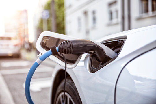 Electric car gettig charged at an charging station