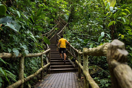 Man walking up stairs near La Fortuna Waterfall, La Fortuna, Costa Rica