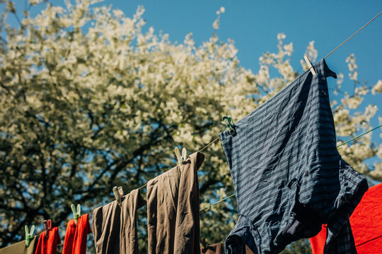 Colorful laundry hanging on a clothesline to dry outdoors in spring